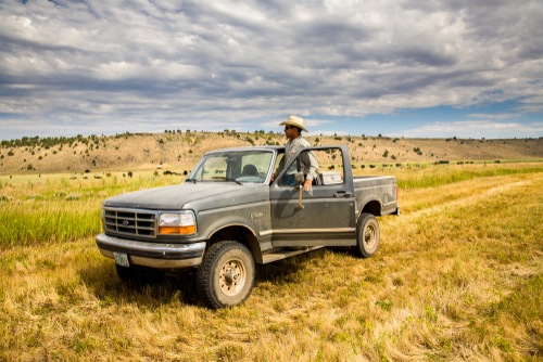 An image of a ranch manager and truck for our FAQ on how to become a ranch manager.